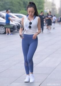 Blue yoga pants with white sleeveless top