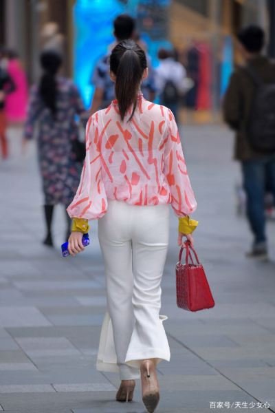 Pink patterned top and white wide-leg pants