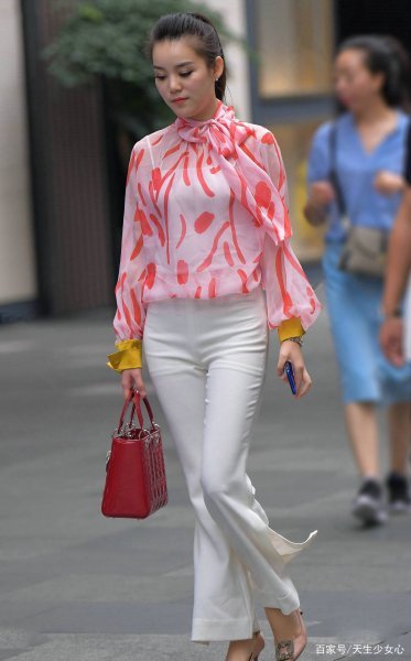 Pink patterned top and white wide-leg pants