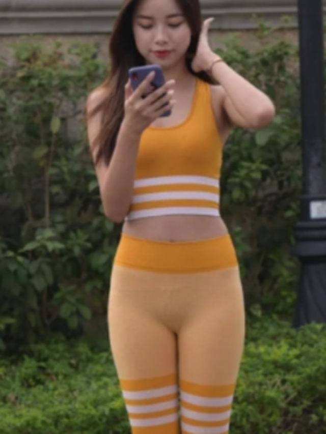 The beauty is dressed in a Yellow Yoga Suit