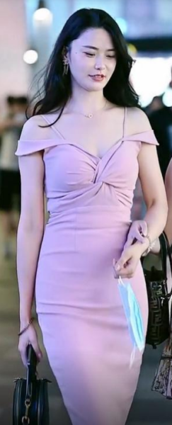 The beauty is in a long pink slim dress