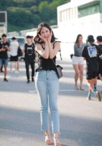 Black mini top with light blue jeans
