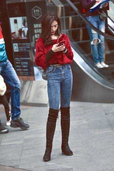 Fancy red top and skinny jeans with high boots