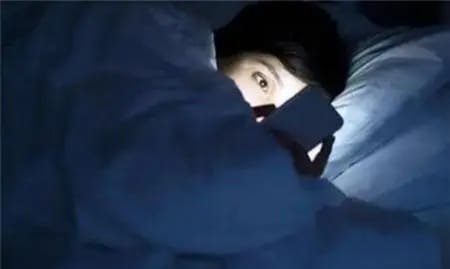 What harms of playing on mobile phones before going to bed