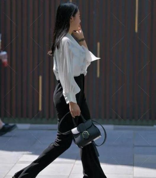 White long-sleeved shirt with black high-waisted trousers