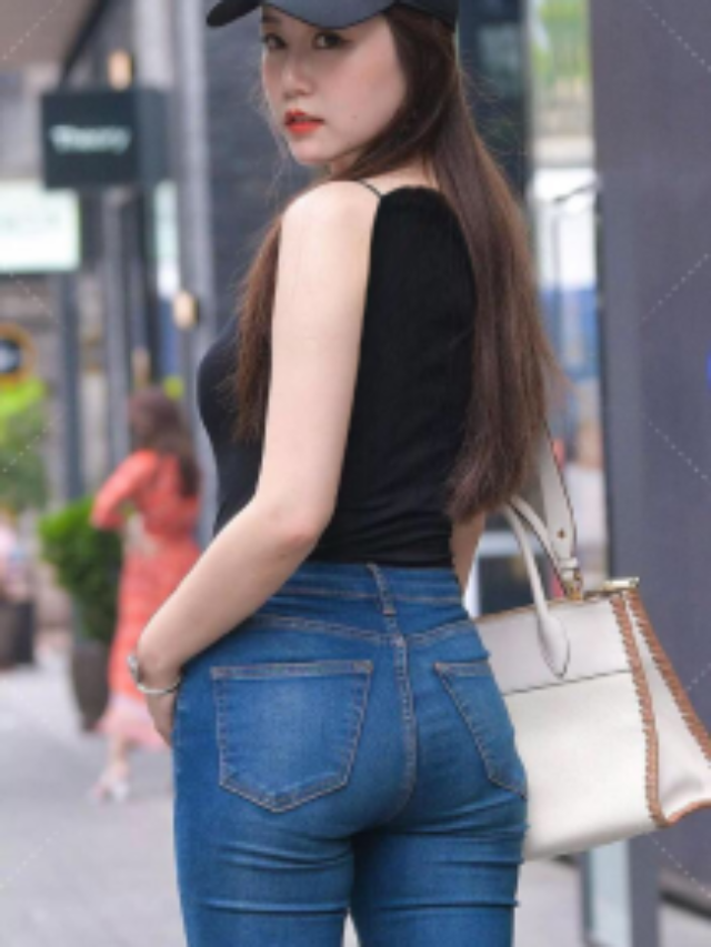 Black camisole with blue slim jeans