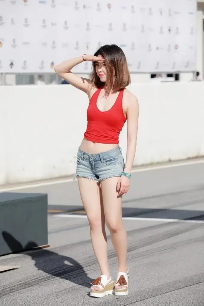 Red sports vest top with denim shorts