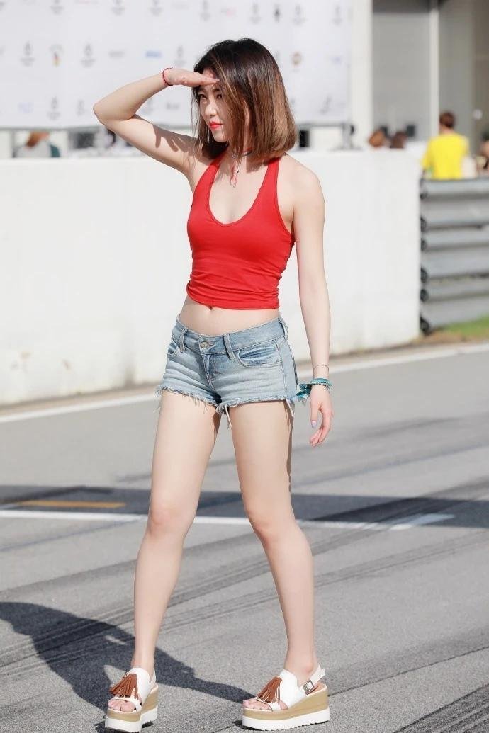 Red sports vest top with denim shorts