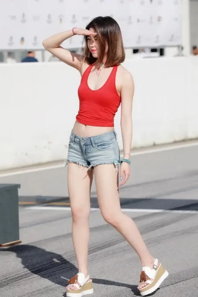 Red sports vest top with denim shorts