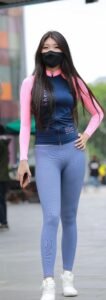 Grey yoga pants with blue and pink full-sleeve tight t-shirt