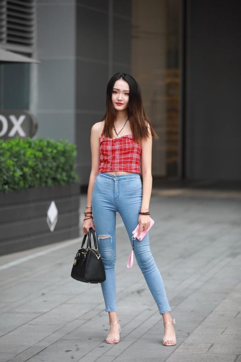 Red check crop top with blue tight jeans