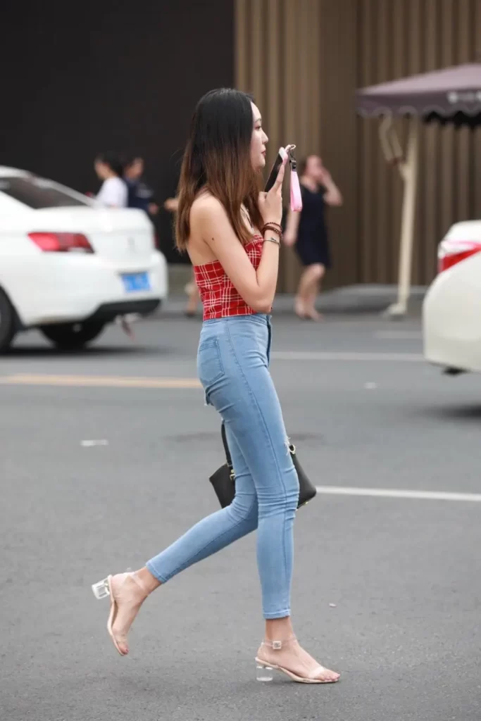 Red check crop top with blue tight jeans