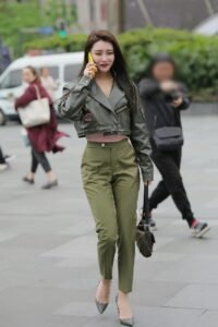 Black leather jacket with army green pants